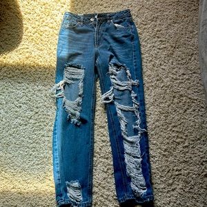 Ripped dark blue jeans